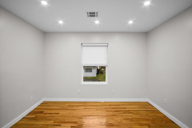 spare room featuring hardwood / wood-style flooring