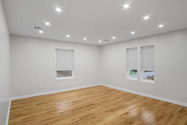 unfurnished room featuring light hardwood / wood-style floors