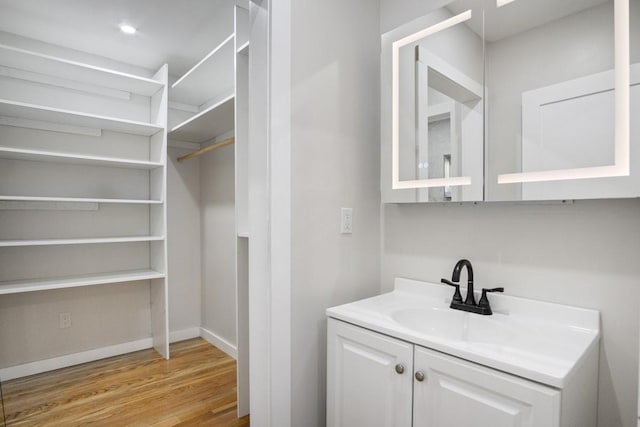 bathroom featuring vanity and hardwood / wood-style flooring