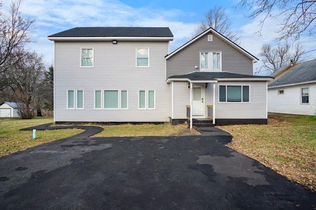 front facade with a front yard