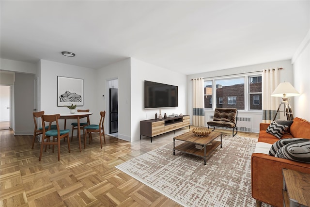 living room with radiator and parquet flooring