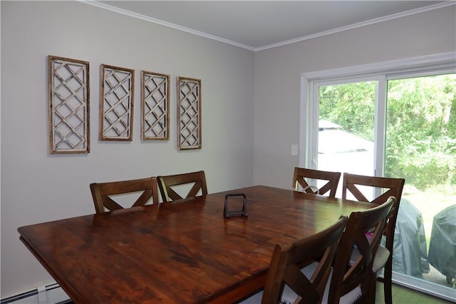 dining area featuring crown molding and a baseboard heating unit