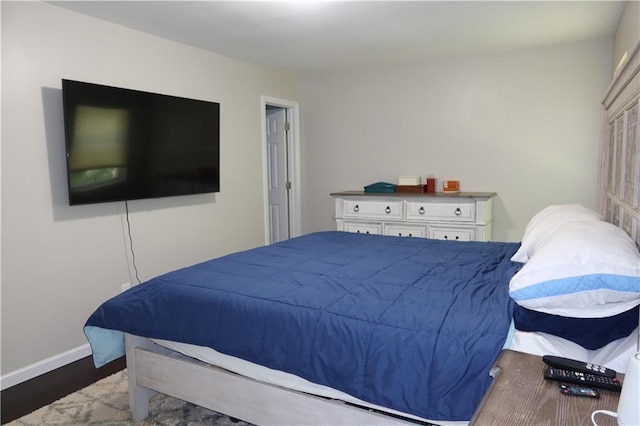 bedroom featuring dark wood-type flooring