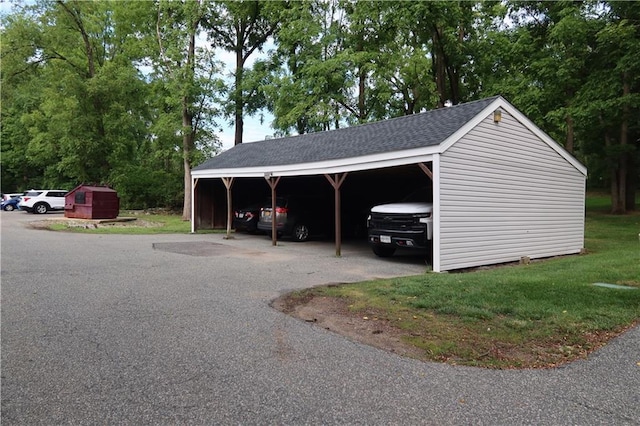 exterior space with a yard and a carport