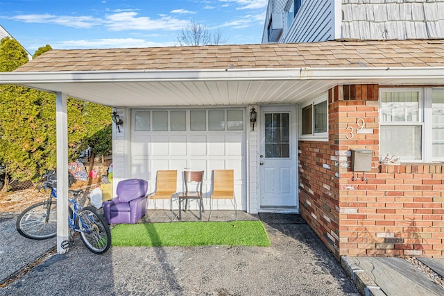 view of exterior entry featuring a garage