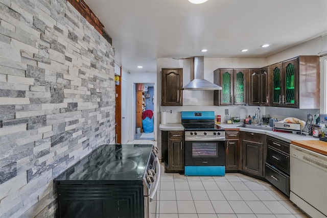 kitchen with dark brown cabinetry, sink, dishwasher, wall chimney exhaust hood, and range