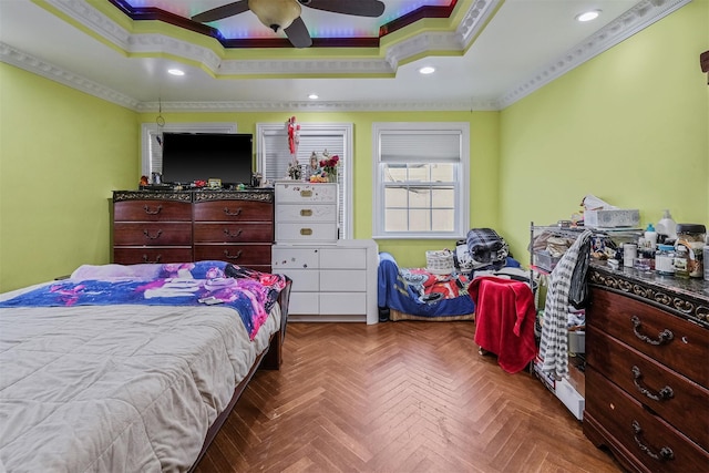 bedroom with a raised ceiling, crown molding, ceiling fan, and parquet flooring