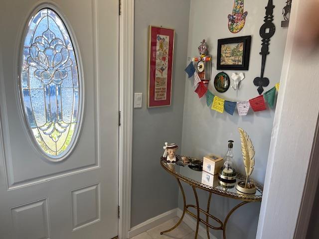 doorway featuring tile patterned flooring