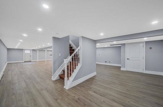 basement featuring light hardwood / wood-style flooring