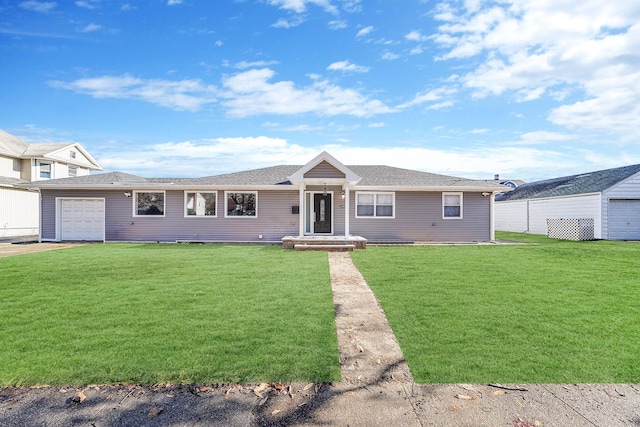 ranch-style house featuring a garage and a front lawn