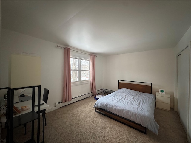 bedroom with carpet flooring and baseboard heating