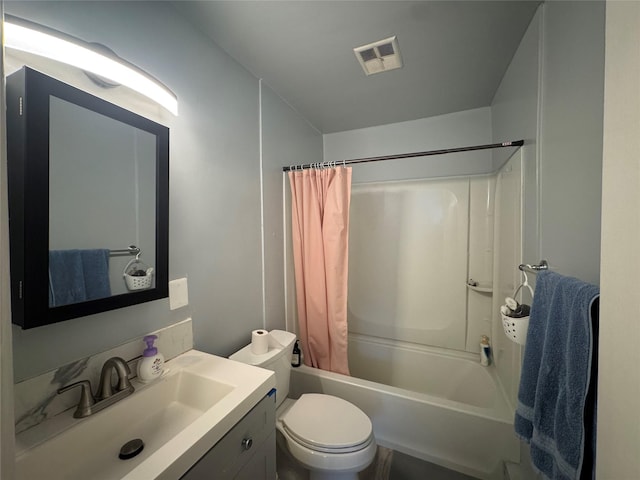 full bathroom featuring vanity, shower / bath combo, and toilet