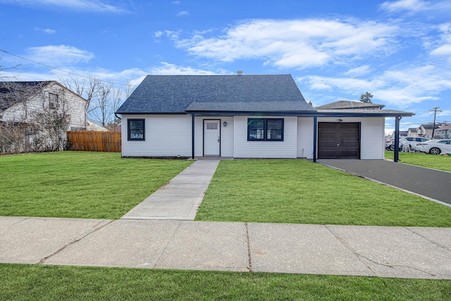 view of front facade with a front yard and a garage