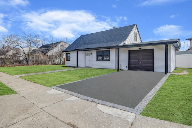 view of front facade with a garage and a front yard