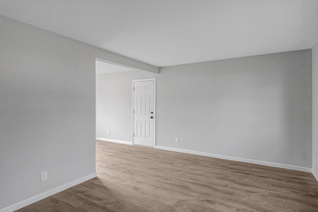 empty room with hardwood / wood-style flooring