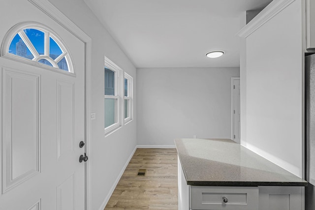 entrance foyer featuring light hardwood / wood-style floors