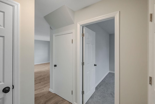 hall with light hardwood / wood-style floors