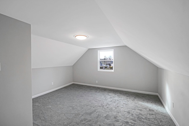 bonus room featuring carpet and lofted ceiling