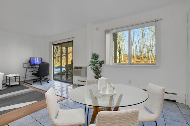 tiled dining area featuring a wall mounted AC and a baseboard heating unit
