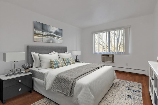 bedroom featuring dark wood-type flooring, a baseboard radiator, and a wall mounted AC