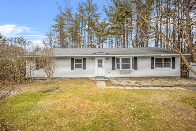 single story home featuring a front lawn