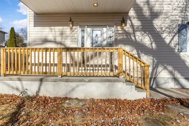 entrance to property with a deck