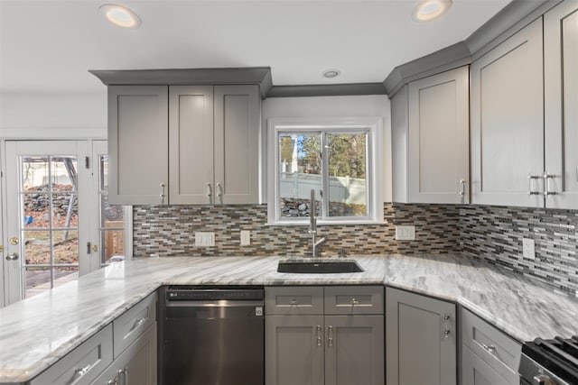 kitchen with stainless steel dishwasher, gray cabinetry, and sink