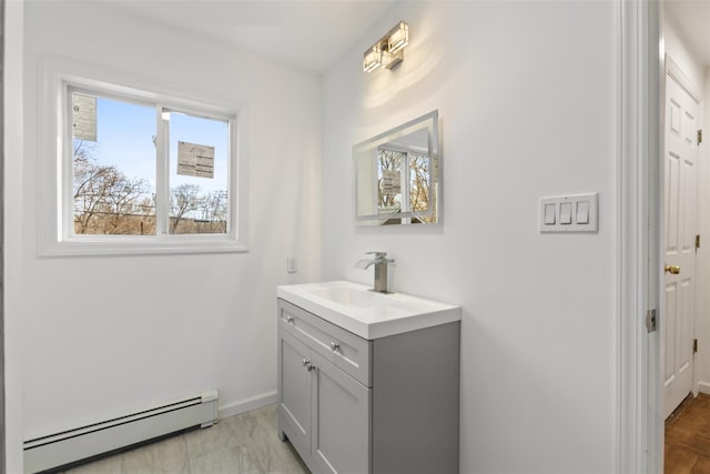 bathroom featuring vanity and baseboard heating