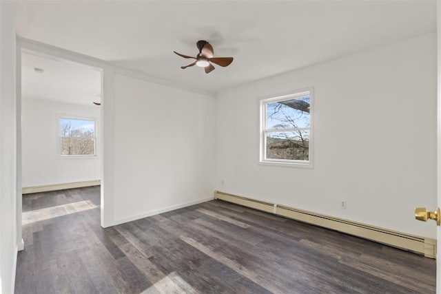 unfurnished room featuring dark hardwood / wood-style flooring, ceiling fan, plenty of natural light, and a baseboard radiator