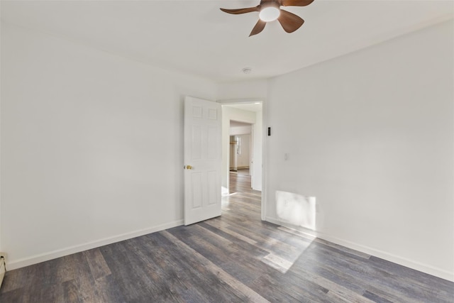 unfurnished room featuring ceiling fan, dark hardwood / wood-style flooring, and a baseboard radiator