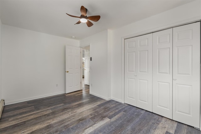 unfurnished bedroom featuring ceiling fan, dark wood-type flooring, and a closet