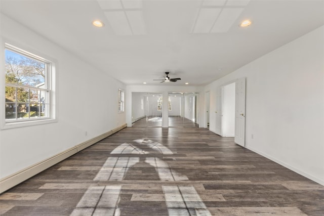 unfurnished room with ceiling fan and dark hardwood / wood-style flooring