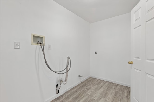 laundry room featuring hookup for an electric dryer, washer hookup, light wood-type flooring, and hookup for a gas dryer