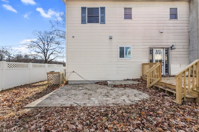 rear view of property with a patio and a wooden deck