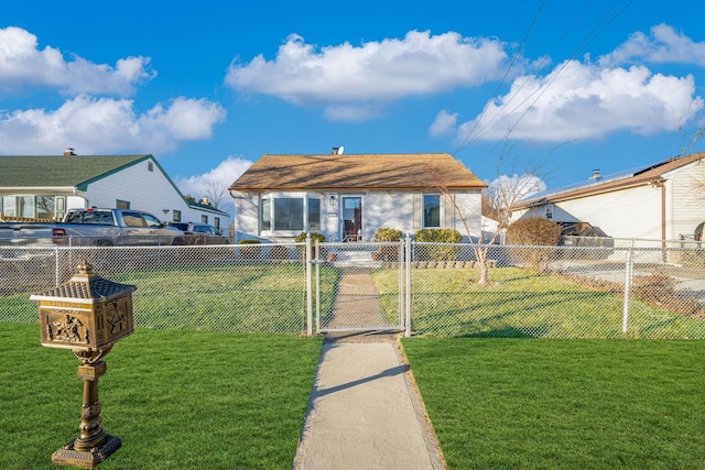 bungalow-style home featuring a front lawn