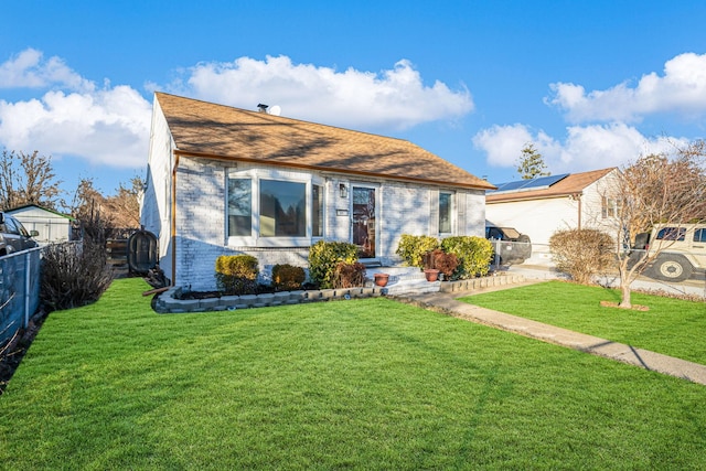 view of front of house with a front lawn