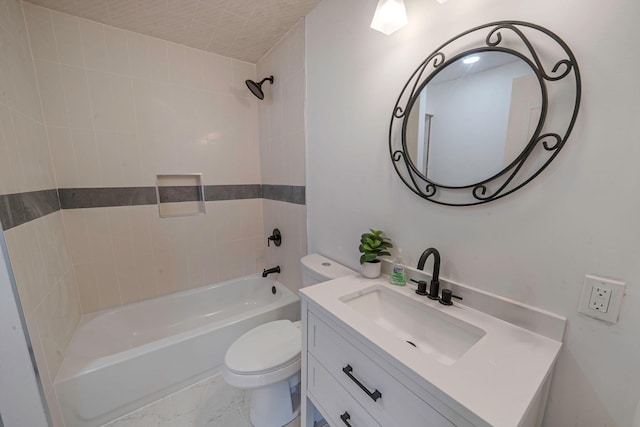 full bathroom featuring vanity, tiled shower / bath combo, and toilet