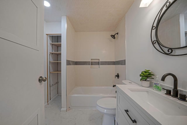 full bathroom featuring vanity, toilet, and tiled shower / bath combo