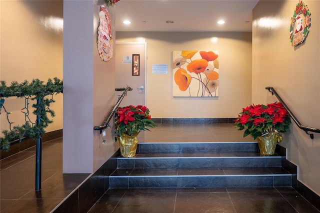 stairs with tile patterned floors