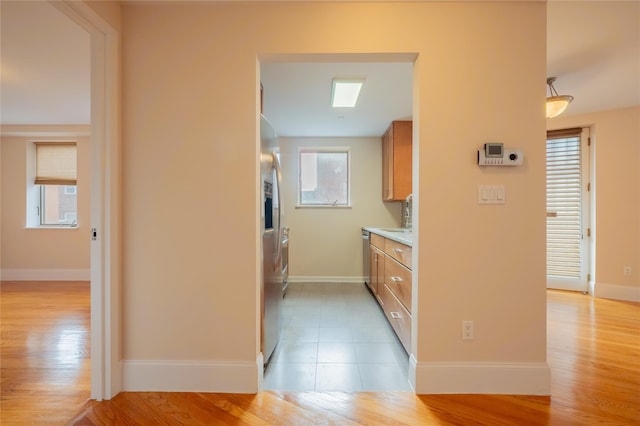 hallway with light wood-type flooring