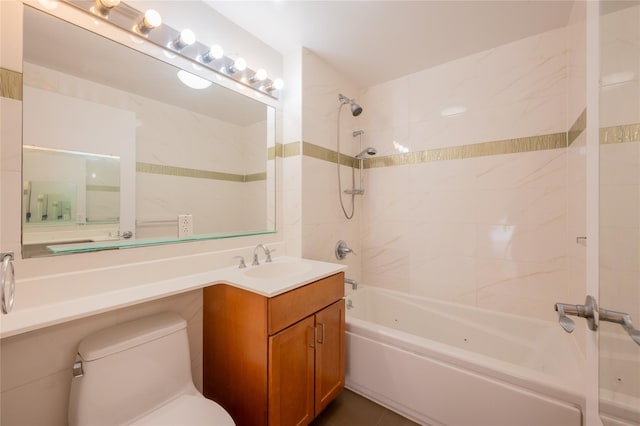 full bathroom featuring vanity, toilet, and tiled shower / bath