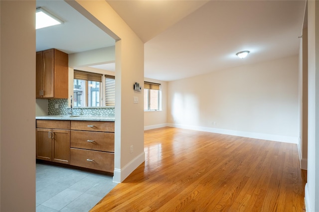 unfurnished living room featuring light wood-type flooring