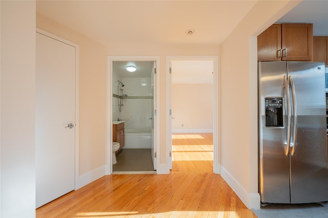 hall with light hardwood / wood-style flooring