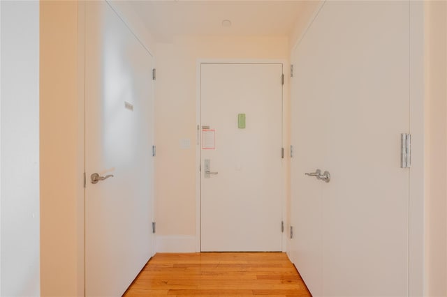 hallway with light wood-type flooring