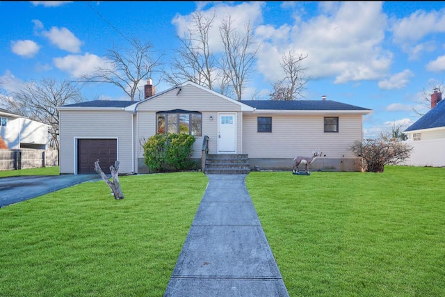 ranch-style home with a front yard and a garage