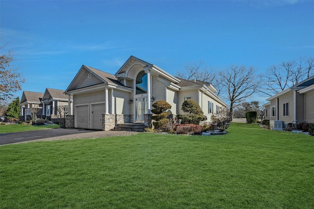 view of side of home with central AC and a lawn