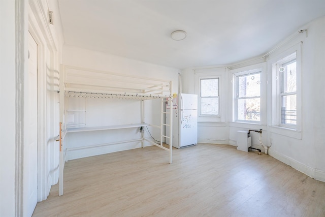 unfurnished bedroom featuring light wood-type flooring