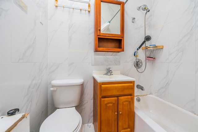 full bathroom featuring vanity, toilet, and tiled shower / bath