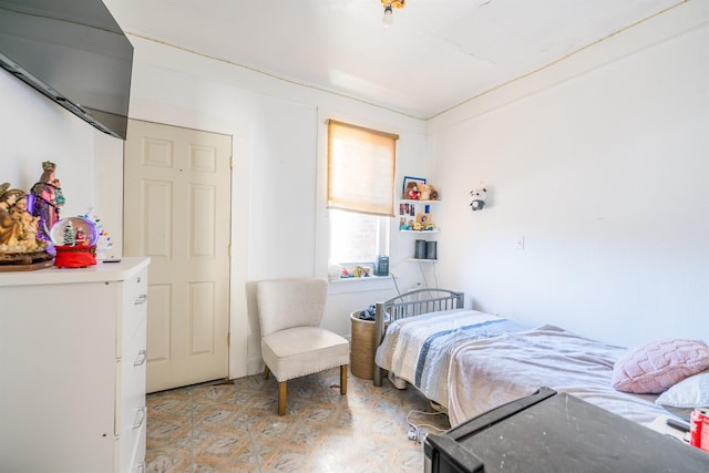 bedroom with crown molding