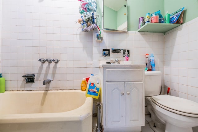 bathroom featuring a tub, backsplash, toilet, vanity, and tile walls